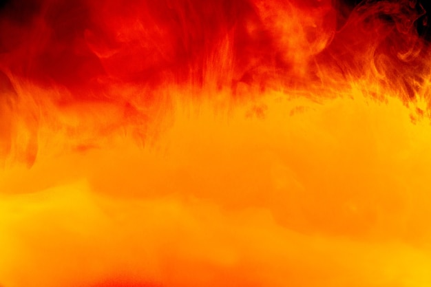 Foto caduta di colore in acqua, fotografata in movimento. inchiostro che vortica nell'acqua.