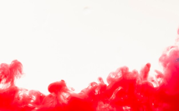 Photo color drop in water on a white background closeup abstraction