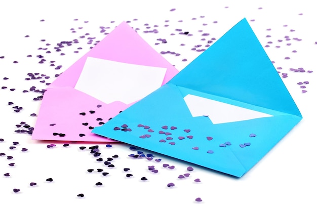 Color envelopes and confetti isolated on white