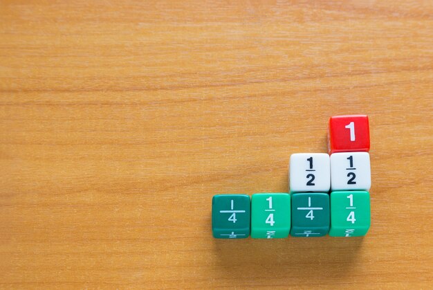 Color fraction dices on wood table