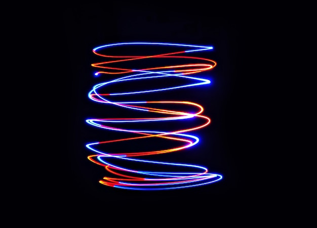 Photo color light lamp move twist on long exposure shot in the dark.