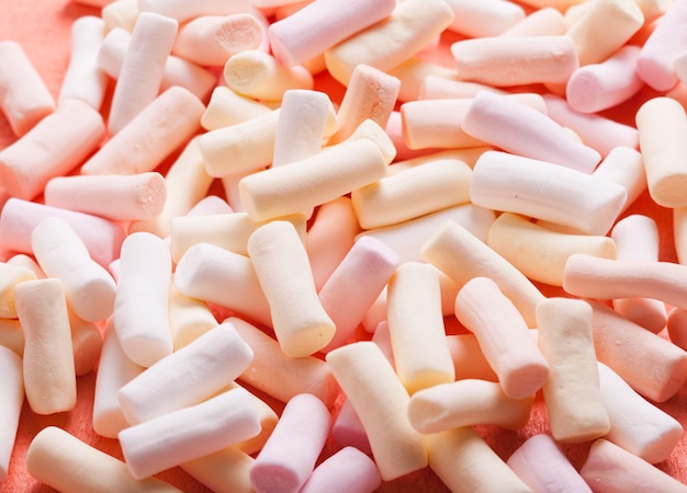 Color marshmallow scattered as a background, close up