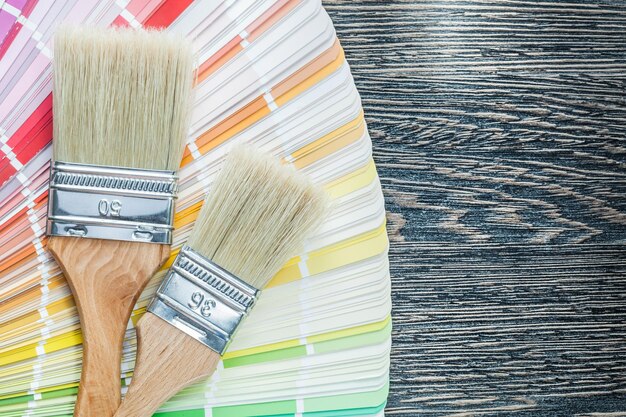 Color palette paint brushes on wooden board