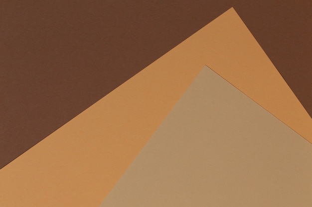 Carta a colori composizione geometria banner parete con toni beige, marrone chiaro e marrone scuro.