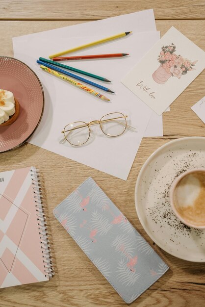 Photo color pencils and eyeglasses on paper cards stock photo