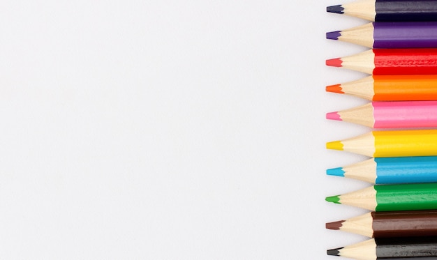 Color pencils isolated over white surface close up