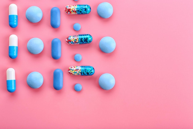 Color pills on pink background