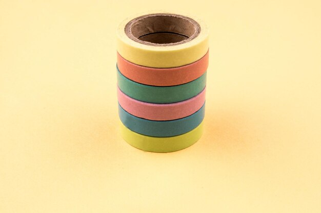 Color ribbon tapes on a yellow background