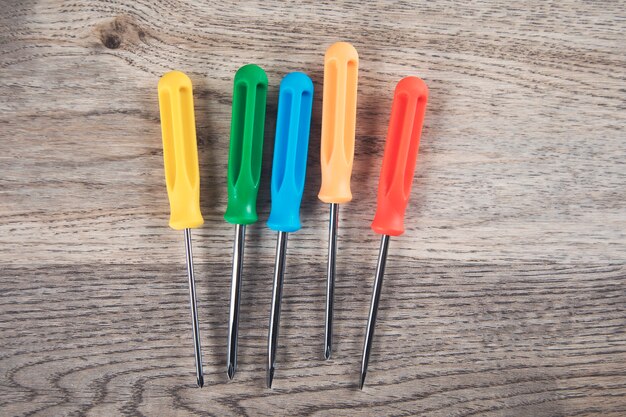 Color screwdriver on the wooden table