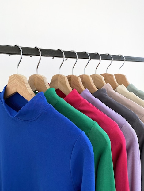 Photo color shirts on a hanger in the store trendy ladieswear still life showcase
