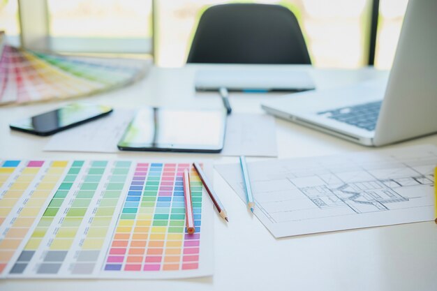 color swatches and pens on a desk