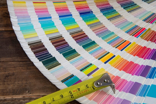 Color swatches used in graphic arts with a measuring tape used in construction