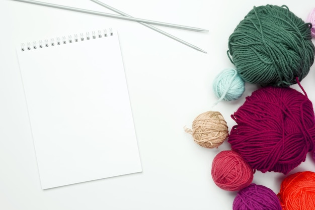 color yarn for knitting white background top view copy space flat lay