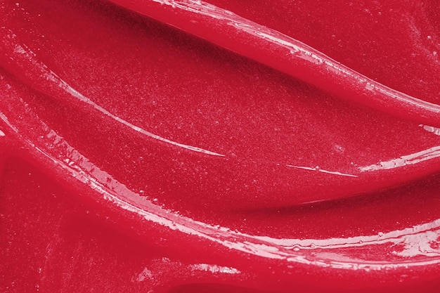 Color of the year 2023 viva magenta red gel texture cosmetic\
clear liquid cream smudge skin care product sample closeup\
toothpaste or wax