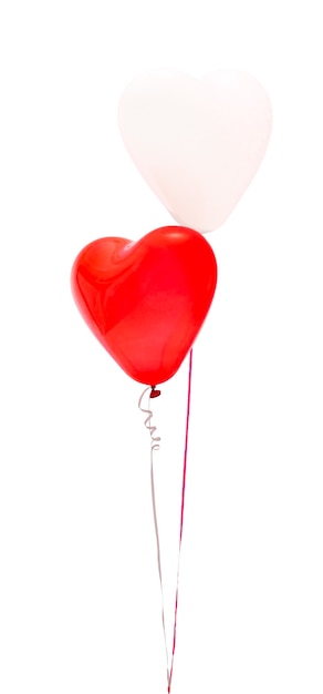 Colored air balloons two in the form of hearts red and white on an isolated white background