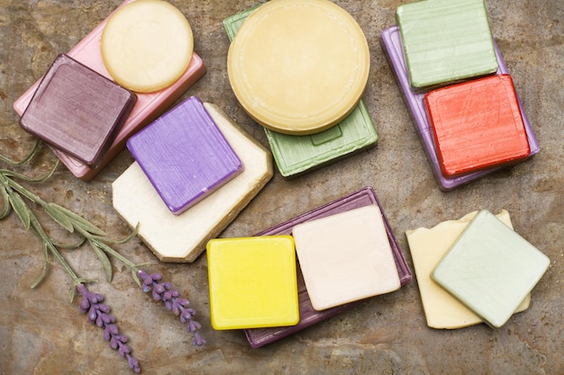 Colored aromatized soaps on a metal table in a top view