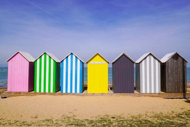 Colored beach huts La BreelesBains city on beach oleron french isle