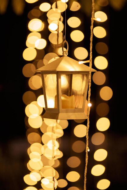 Colored blurred bokeh christmas garlands on dark background