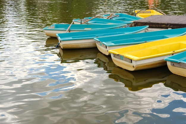 Colored boats for water for rent. Water activities in nature. High quality photo