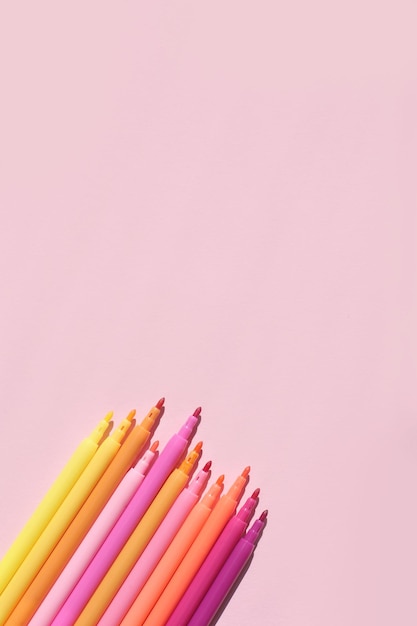 Colored bright stylish felttip pens on a bright colored background