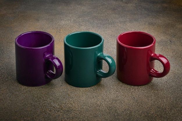 Colored ceramic mugs close up