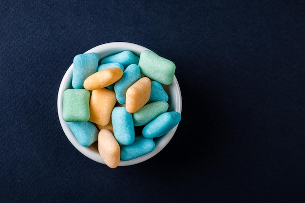 Colored chewing gum in a bowl