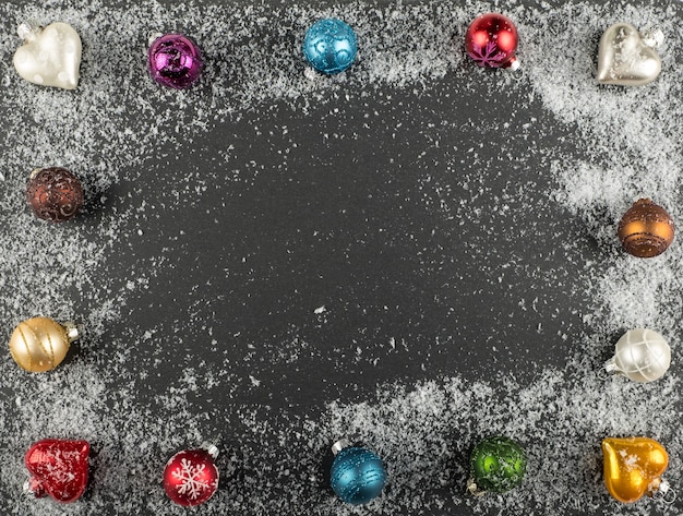 Colored Christmas decorations on a black background