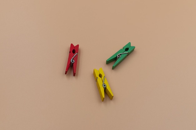 Photo colored clothespins on a pastel background