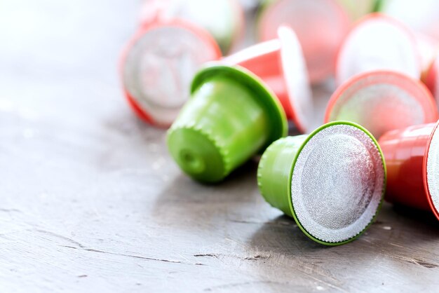 Colored Coffee capsules for coffee machine lying on background Copy space