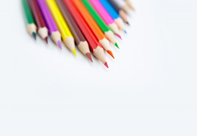 Colored crayon pencils isolated on white background.