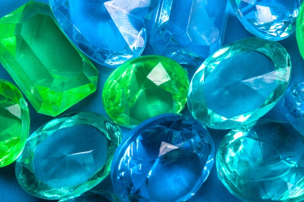 Colored crystals of blue and green on a blue background