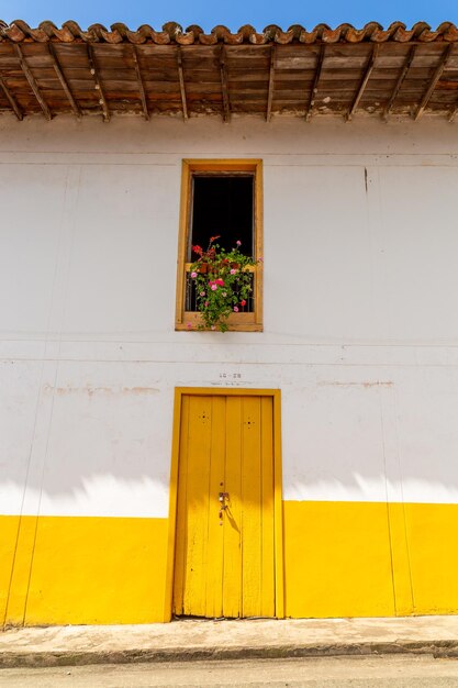 Colored door in a house in a town in colombia