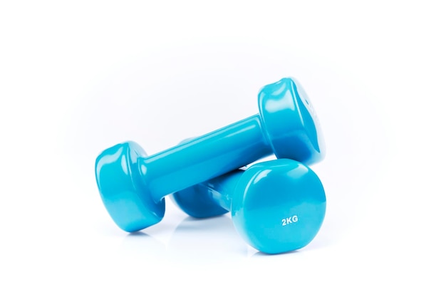 colored dumbbells isolated on white Light blue glossy dumbbells isolated on white background