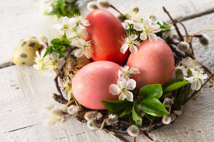 Photo colored easter eggs closeup willow branches and spring flowers on a white wooden background xa