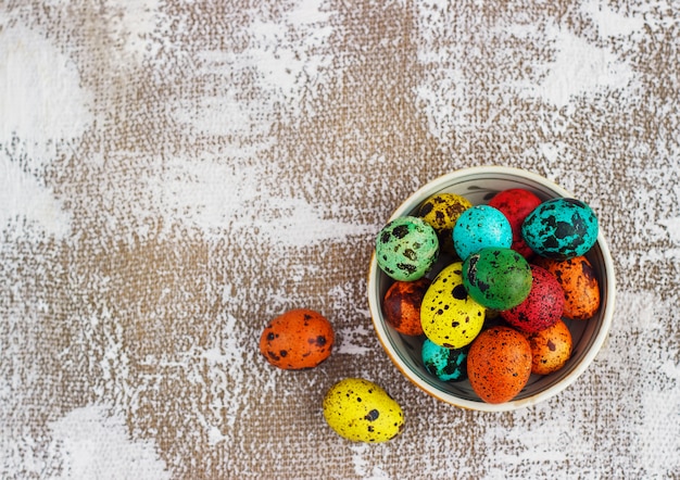 Photo colored easter eggs on a light canvas background