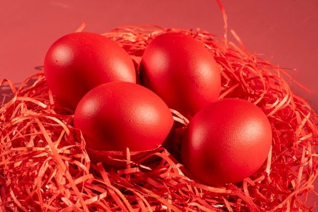 Colored eggs symbolize Easter in shades of red