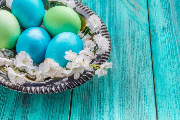 Colored eggs on a wooden background