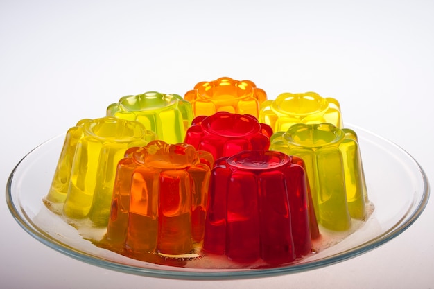 Colored fruit jelly on white background