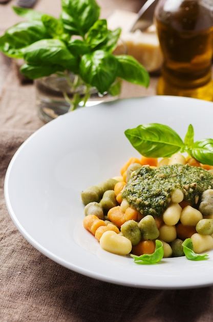 Colored gnocchi with pesto