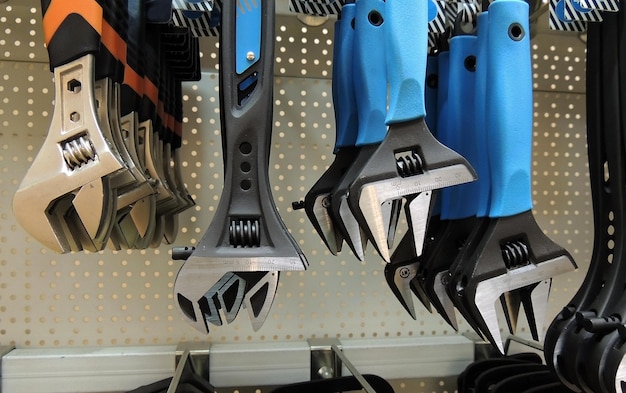 Colored grip wrenches on the shelf at hardware shop