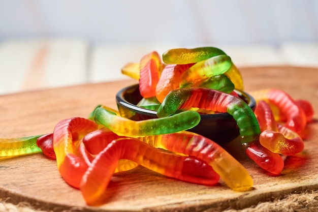 Colored gummy worms in a bowl