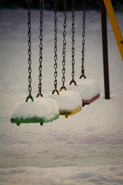 colored hammocks in a square with snow