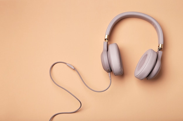 Colored headphones on a colored vintage background