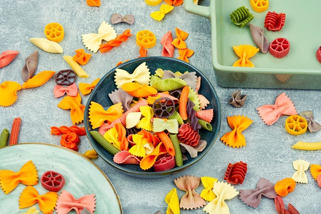 Colored macaroni on the plate