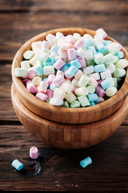 Colored marshmallow on the wooden table