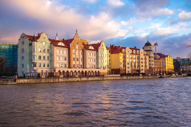 Colored old houses on the embankment at sunset Kaliningrad Russia January 17 2022