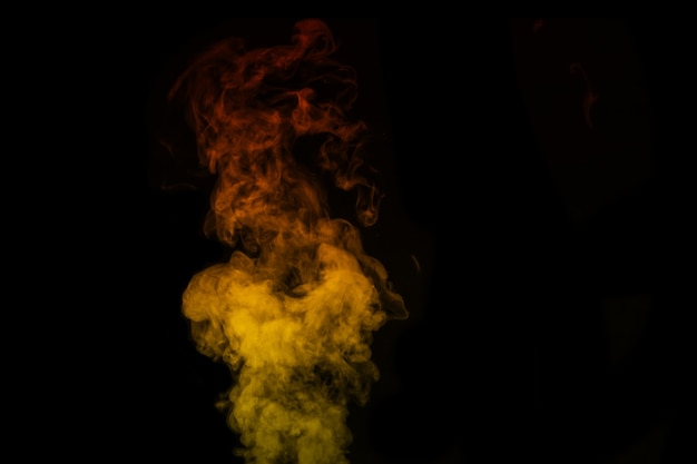 Colored orange yellow steam, smoke on a black background to superimpose on your photos. Yellow-orange smoke, steam, aroma. Create mystical Halloween photos. Abstract background, design element