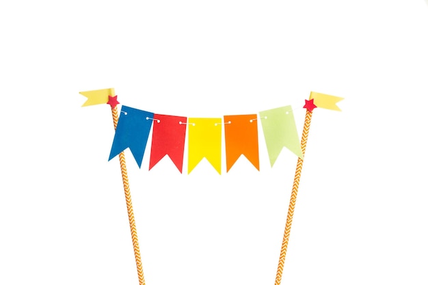 A colored paper festoon birthday decoration on a white background