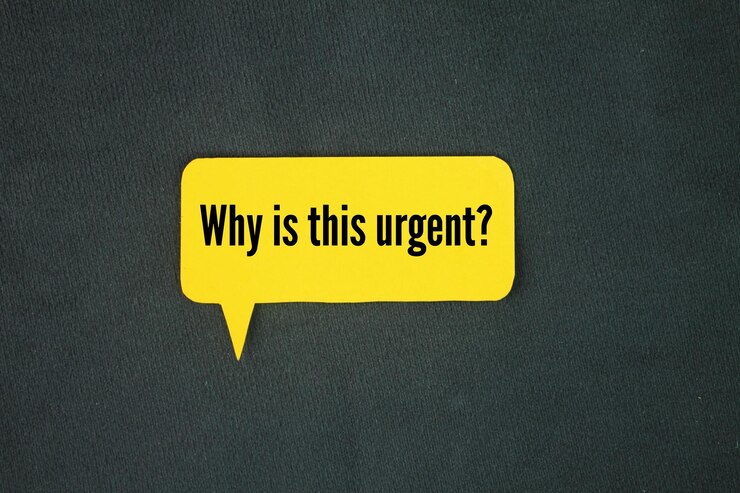 Photo colored paper with the question words why is this urgent
