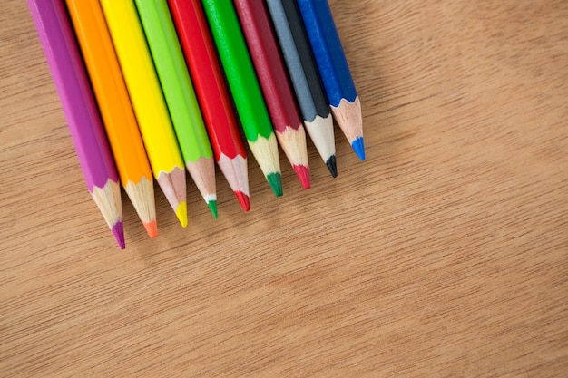 Colored pencils arranged in a row